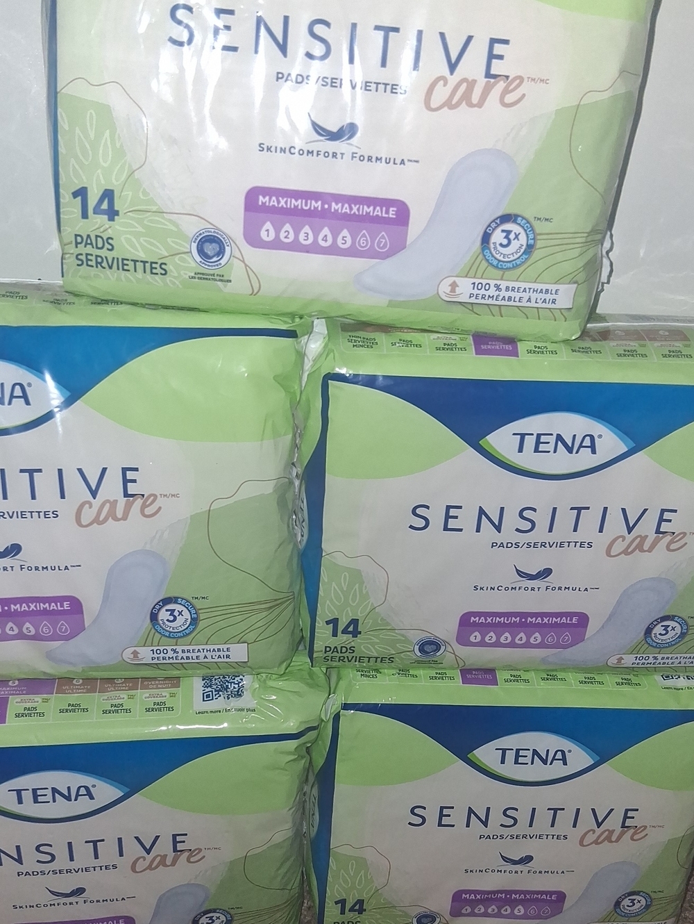 5 brand new packs of Tena MAXIMUM PADS.